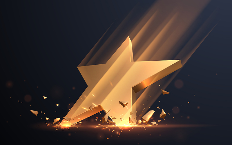 Gold star hit with sparks in vector. CREDIT - iStock-1310626999